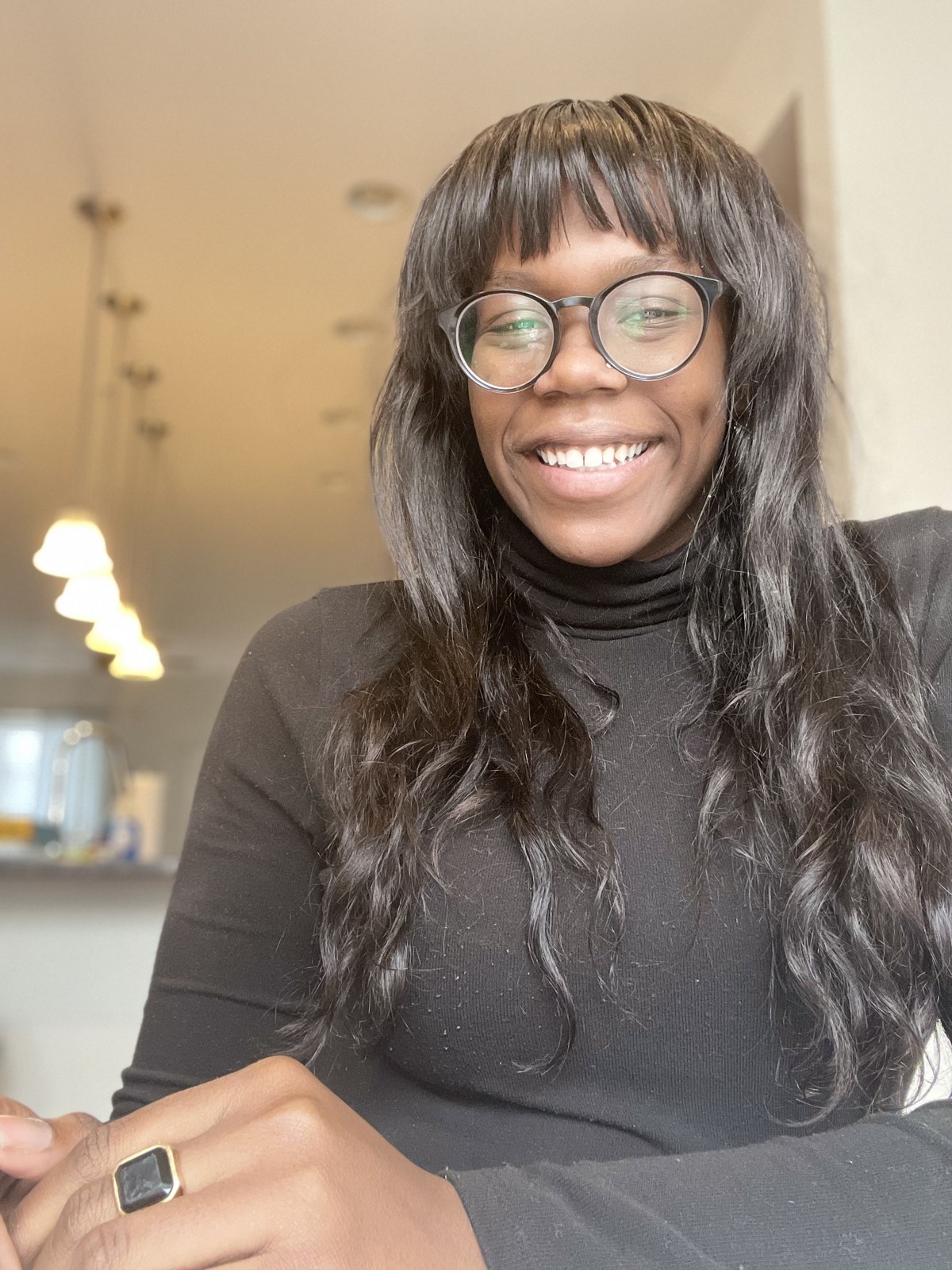 Tanzania Brown smiling in a classroom setting